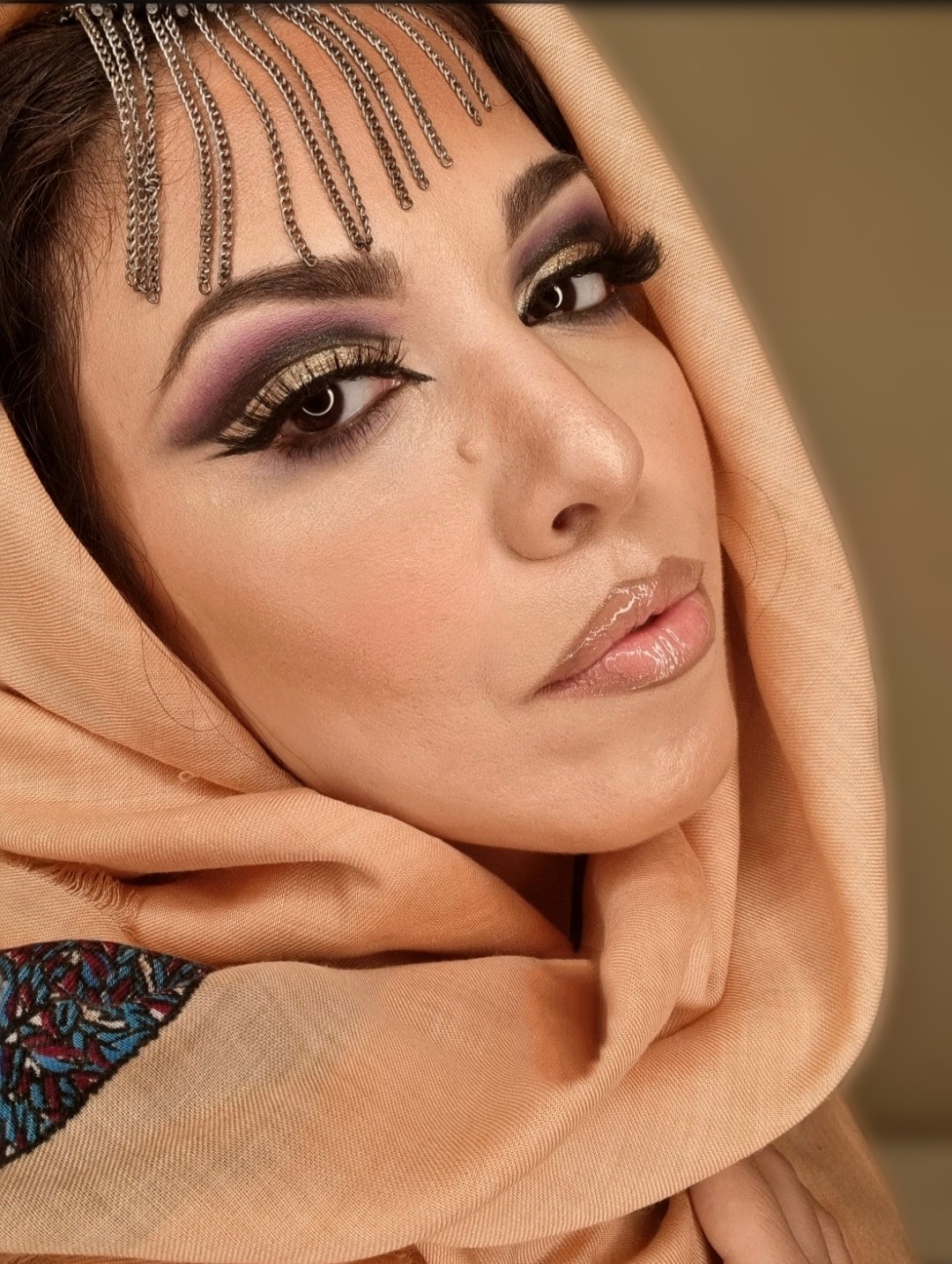 Creative makeup look featuring glittery violet eyeshadow and metallic magenta lipstick by Makeover by Rafaella.